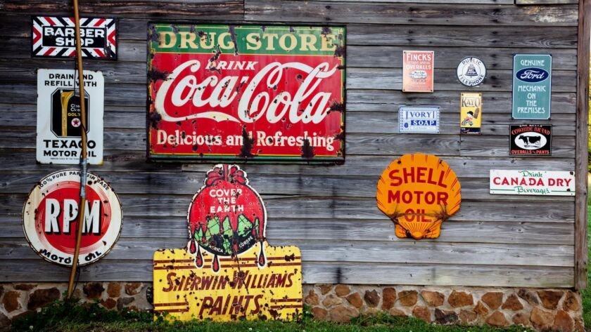 drug store drink coca cola signage on gray wooden wall